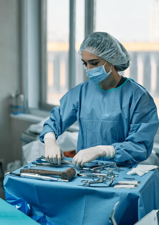 Surgical assistant setting up an instrument tray
